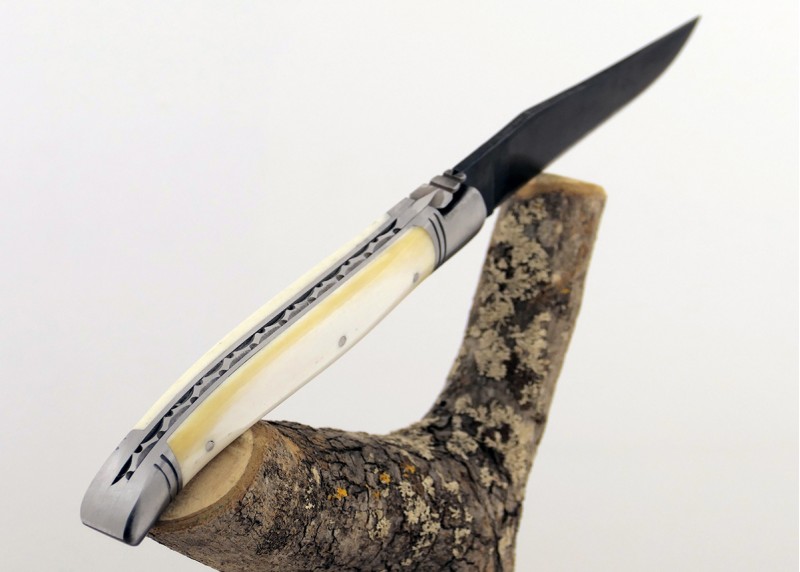 Forged Laguiole folding knife with bone handle and raw blade finish (premium artisan look)